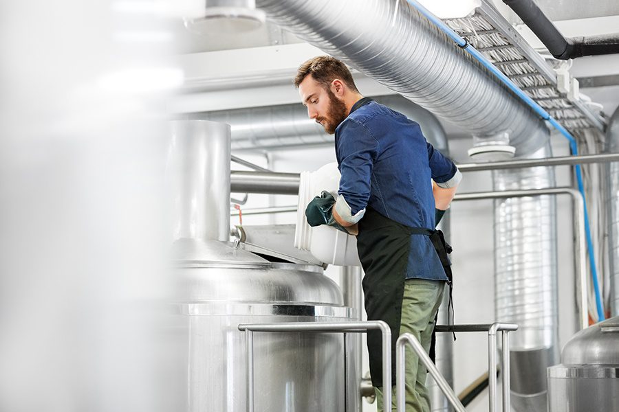 Specialized Business Insurance - Man Working at a Craft Brewery Plant